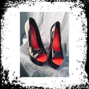 Hot Black/Red patent leather vixen heels.
